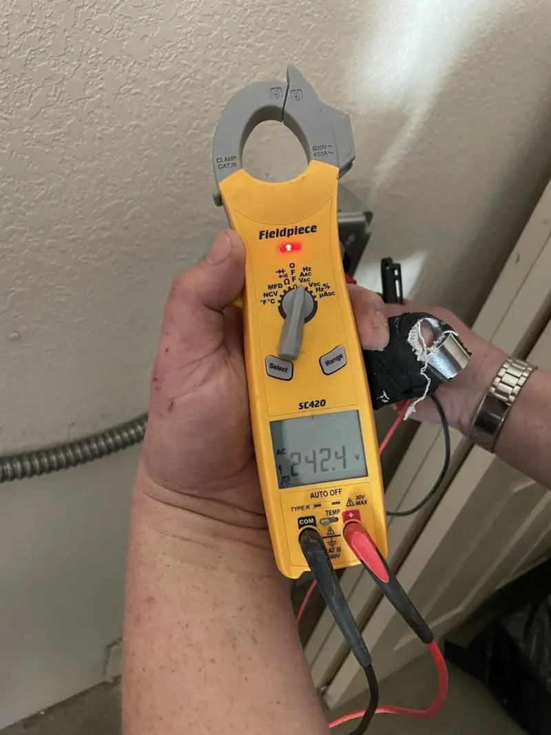 Voltage testing with clamp meter during Generator Installation in Rancho San Diego
